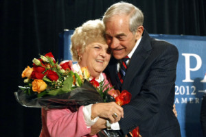 Republican presidential candidate Rep. Ron Paul hugs his wife Carol after presenting her with a bouquet of flowers for their 55th wedding anniversary today in Las Vegas